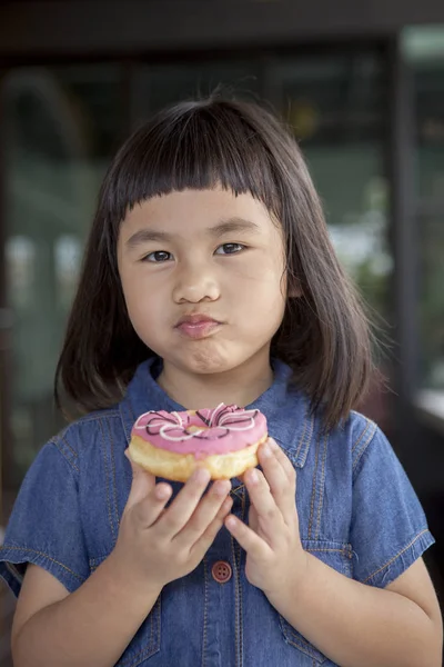Asian children happiness face with sweet candy in hand — Stock Photo, Image