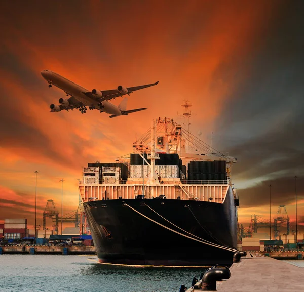 Container ship and container in shipping port cargo plane flying — Stock Photo, Image