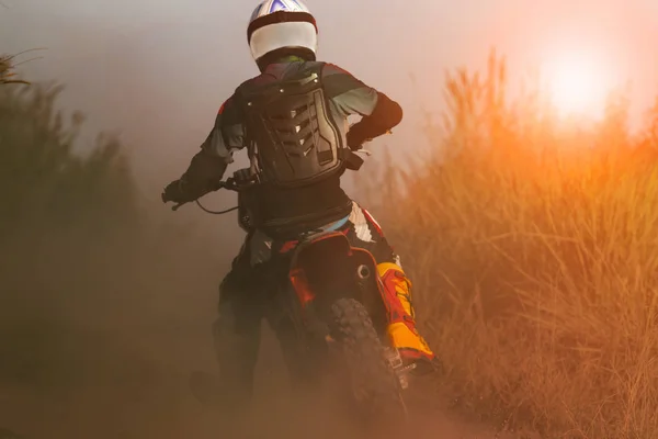 Man riding sport enduro motorcycle on dirt track — Stock Photo, Image