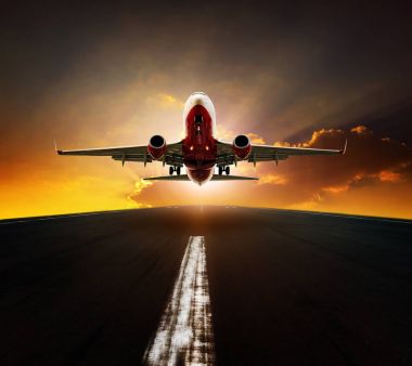 passenger plane take off from airport runway agasint beautiful s clipart