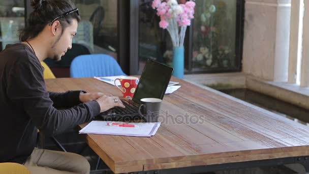Asian young freelance man working in home office — Stock Video