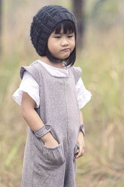 Portrait of lovely asian children with winter wool hood standing — Stock Photo, Image