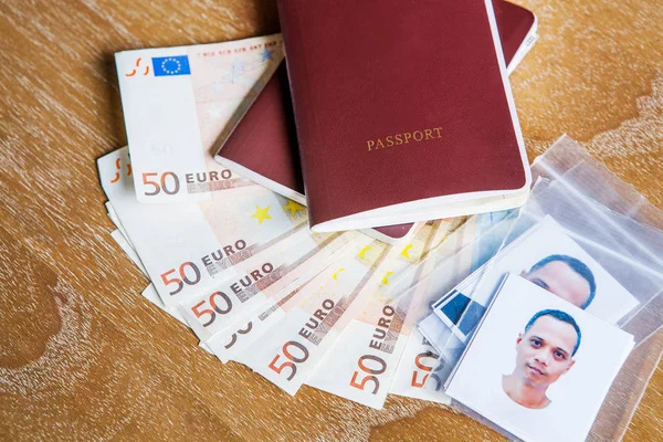 red cover passport book ,face of asian man with fifty euro bank