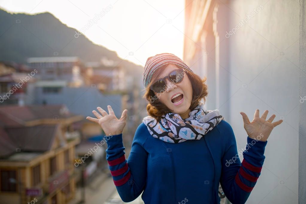face of traveling  woman happiness emotion and sun rise at town 