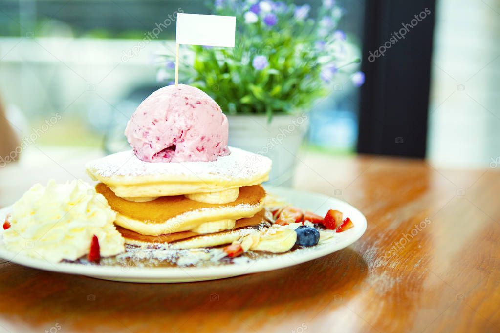 banana pancake with strawberry icecream on top ready to eat on t