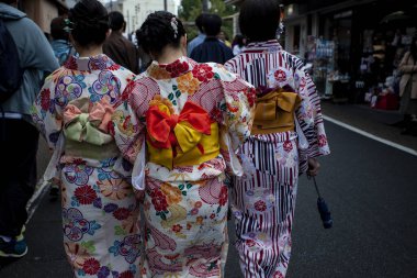 kyoto japan - november10,2018 : unidentified woman wearing traditional kimono walking in yazaka shrine street one of most popular traveling destination in kyoto japan