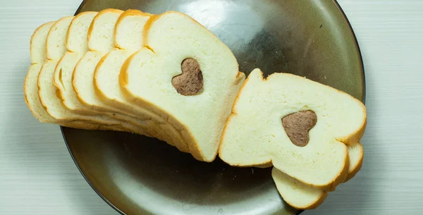 Photo love delicious slice of bread — Stock Photo, Image