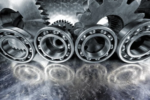 Titanium and steel cogwheels — Stock Photo, Image