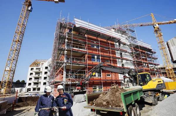 Bouwvakkers en bouwplaats Stockfoto