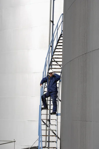 Oil Gas Worker Large Industrial Fuel Storage Tanks Royalty Free Stock Photos