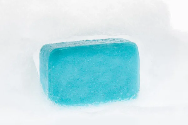 Blue soap with foam on white background — Stock Photo, Image