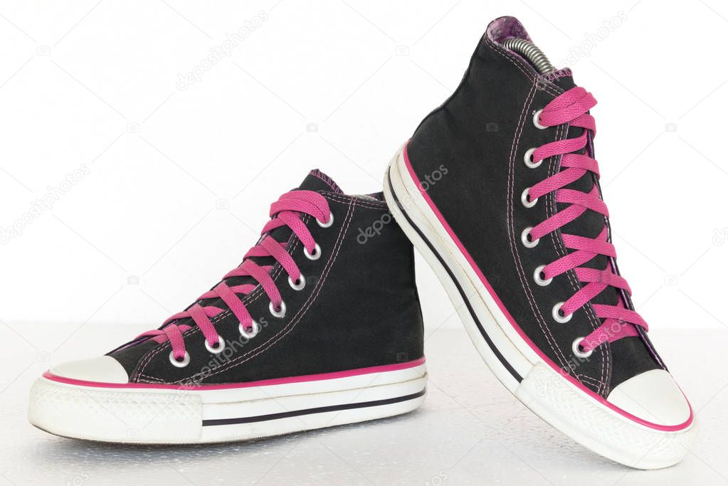 vintage style of sport black and pink sneaker shoes on white bac