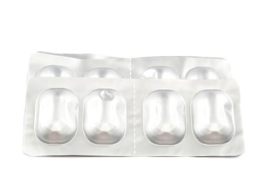 blister paketleri beyaz zemin üzerine hap.