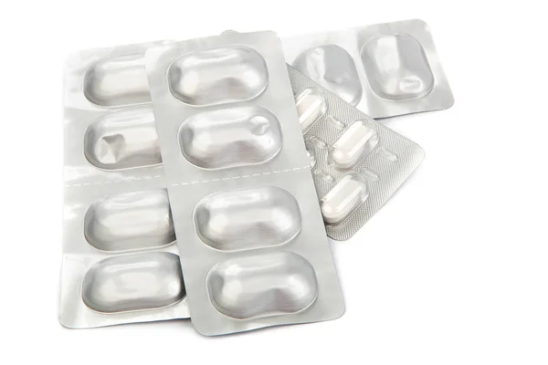 Pills in blister packs on white background. — Stock Photo, Image