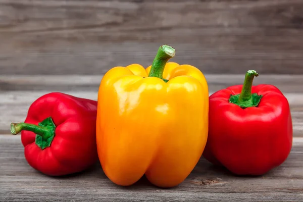 Fresh sweet bell peppers on wooden boards — Stock Photo, Image