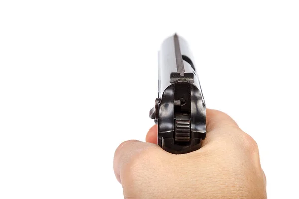 Waffe in der Hand isoliert auf weißem Hintergrund — Stockfoto