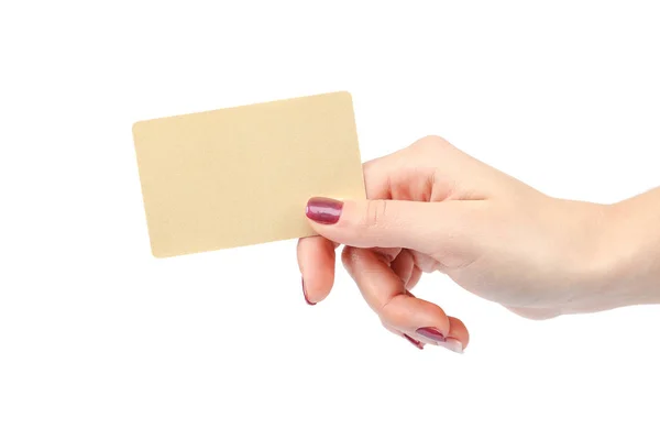 Beautiful female hand with manicure holds gold card — Stock Photo, Image