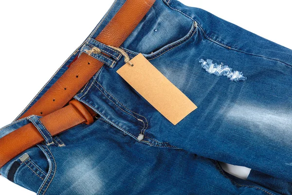 Jeans with a brown belt on white background — Stock Photo, Image