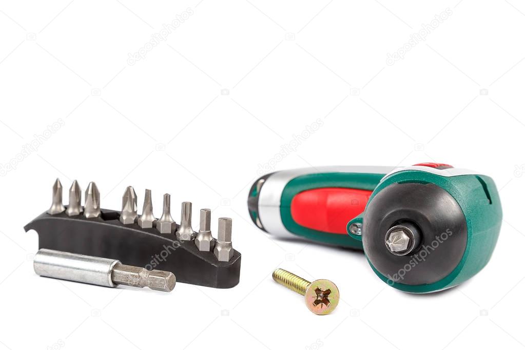 Electric screwdriver with interchangeable bits on white backgrou