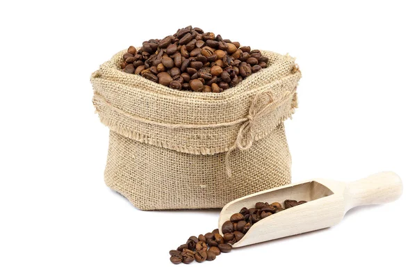 Coffee beans in canvas bag with wooden scoop — Stock Photo, Image