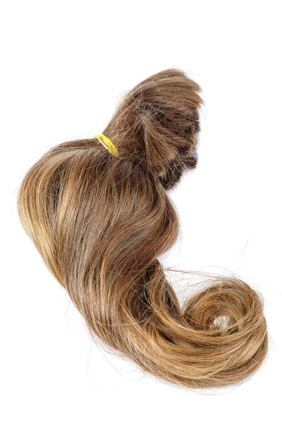 Curl of blond hair on a white background.