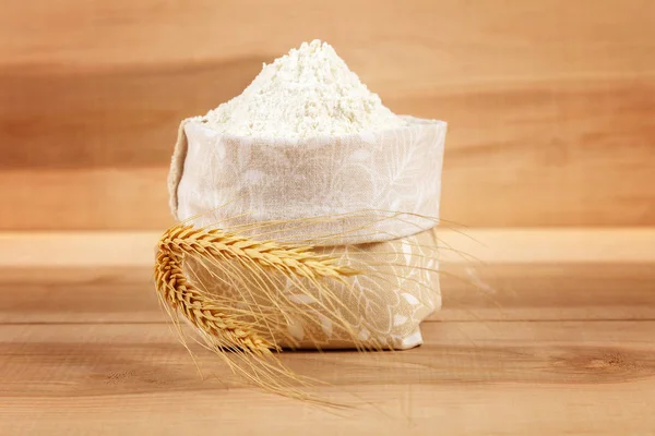 Flour in a bag with wheat ears. — Stock Photo, Image