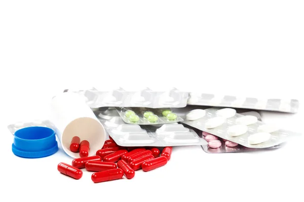 Medicijnen capsules pillen druppels op een witte achtergrond — Stockfoto