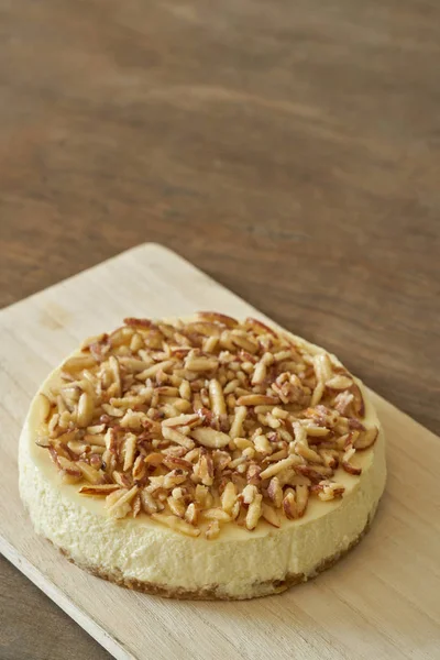 Cheesecake with almond sliced topping — Stock Photo, Image