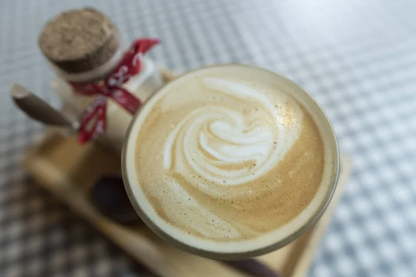 Coffee latte art on table — Stock Photo, Image