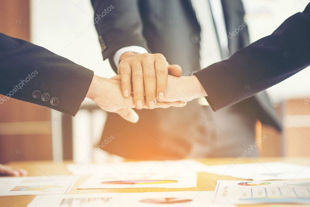 confident business man shaking hands during a meeting in the office, success, dealing, greeting and partner concept.