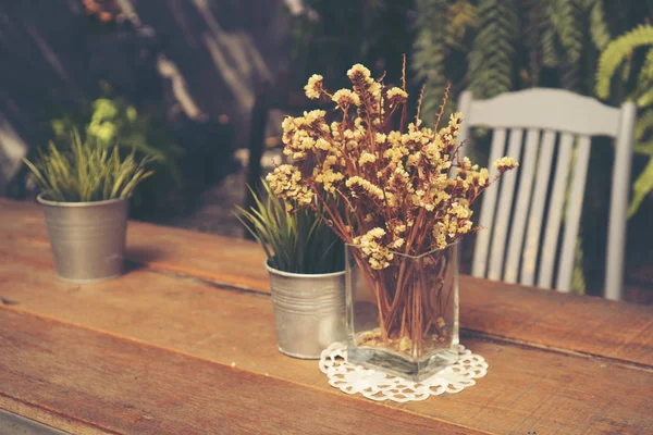 Bouquet of dried flowers for decoration in coffee shop, vintage filter image