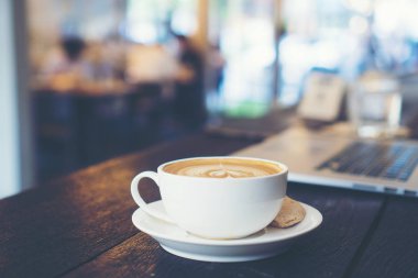 coffee latte art with tablet, working in the cafe