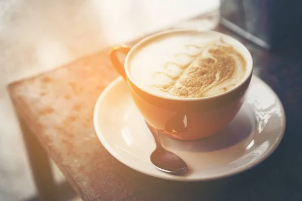 coffee latte art in coffee shop cafe, vintage filter image