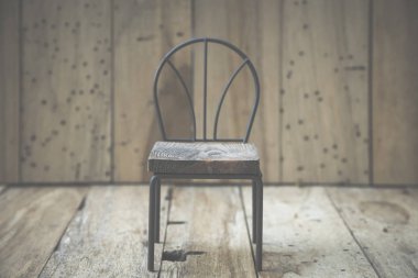 vintage chair on wooden background 