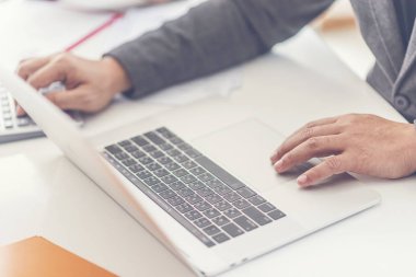 close-up of a businessman working with laptop 