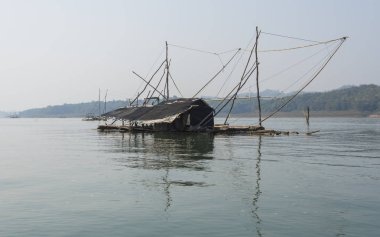 destroyed old hut on the water