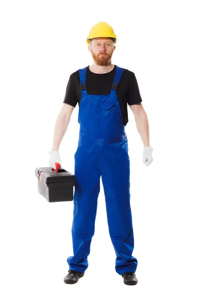 Man builder in the uniform holds a tool box — Stock Photo, Image