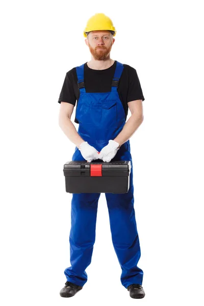 Budowniczy człowiek w mundurze posiada Skrzynka na narzędzia — Zdjęcie stockowe