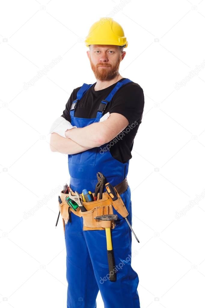Man builder in the uniform with construction belt