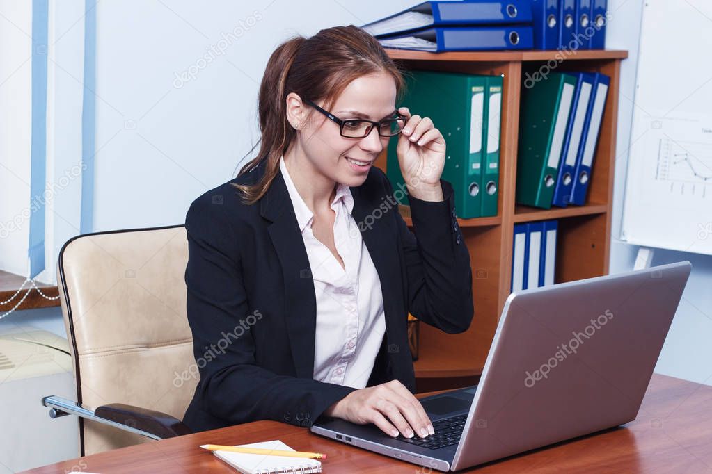 Business concept: attractive woman working in the office