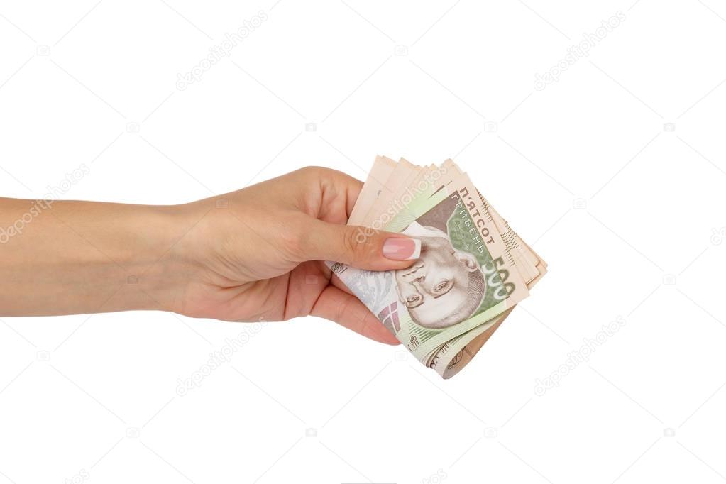 Woman's hand holds banknotes of five hundred hryvnias, isolated
