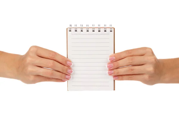 Mãos de mulher mantém caderno limpo, isolado em branco — Fotografia de Stock