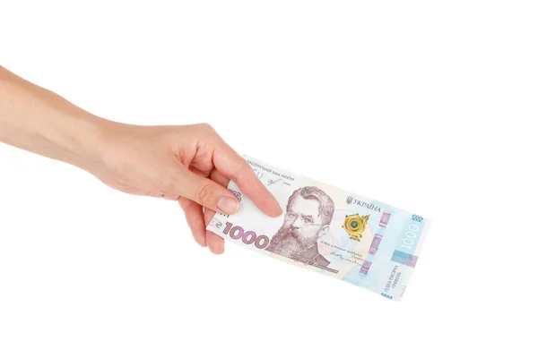 Duizend hryvnia 's door één bankbiljet in de hand, geïsoleerd Stockfoto