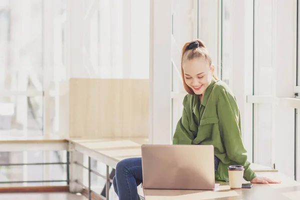 Young Beautiful Woman Sits Laptop Soft Focus Background Royalty Free Stock Images