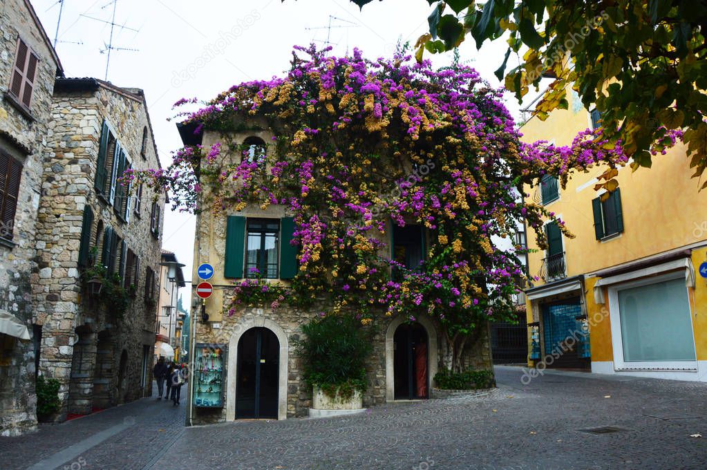 Sirmione old town with flowers, Lake Garda in Italy 