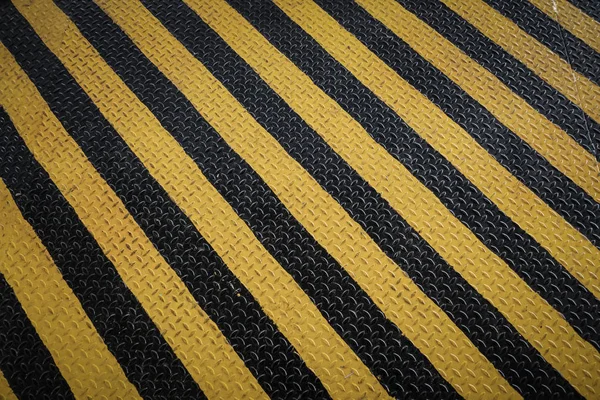 Señal de advertencia de marcado amarillo y negro, fondo grunge — Foto de Stock