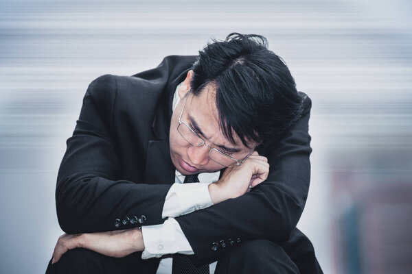 asian businessman sad worry tired and headache, stress 