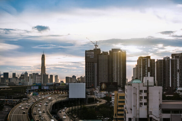 Road traffic transportation and city in bangkok at twilight sunray and white big billboard