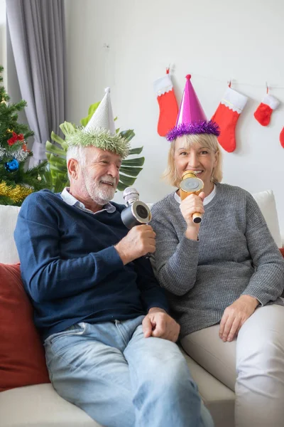 senior elderly caucasian old man and woman happy to sing a song