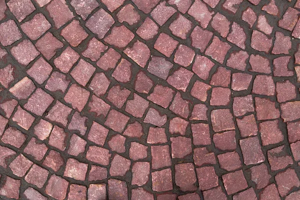 Blocos de pavimentação feitos de pequenos quadrados de marrom — Fotografia de Stock
